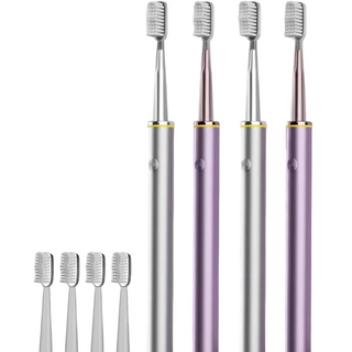 Electric toothbrushes with brush heads on a gray background